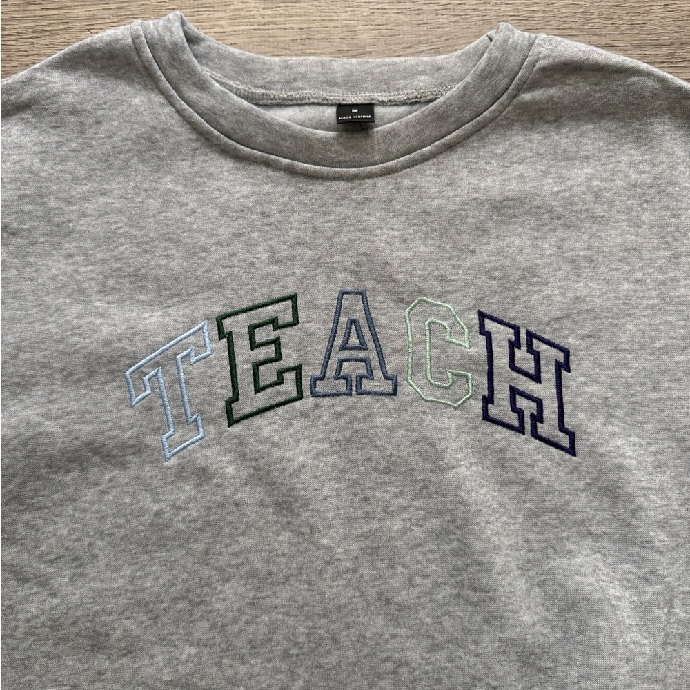 'TEACH' Embroidered Sweatshirt